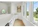 Bright bar with white cabinets and countertop, a sink, and lots of natural light at 2200 N Glenwood Dr, Tampa, FL 33602