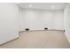 Finished basement with painted walls and a sleek terrazzo floor at 2200 N Glenwood Dr, Tampa, FL 33602