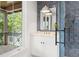 Bathroom with a large window, white vanity and view of the balcony at 2200 N Glenwood Dr, Tampa, FL 33602