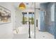 Bathroom boasts a soaking tub, glass shower, with a stylish light fixture at 2200 N Glenwood Dr, Tampa, FL 33602
