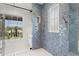 Luxury bathroom with a glass enclosed shower and a window with a neighborhood view at 2200 N Glenwood Dr, Tampa, FL 33602