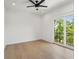 Bedroom featuring wood floors, fan and a balcony that offers a scenic view at 2200 N Glenwood Dr, Tampa, FL 33602