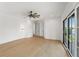 Spacious bedroom featuring hardwood floors, balcony access and a ceiling fan at 2200 N Glenwood Dr, Tampa, FL 33602
