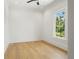 Bright, airy bedroom with beautiful hardwood floors, large window and natural light at 2200 N Glenwood Dr, Tampa, FL 33602