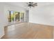 Bright and airy bedroom with hardwood floors and access to balcony at 2200 N Glenwood Dr, Tampa, FL 33602