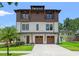 Striking, modern two-story home with a two-car garage, balconies, and professionally landscaped yard at 2200 N Glenwood Dr, Tampa, FL 33602