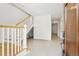 Bright foyer featuring terrazzo floors, a staircase, and an inviting open layout at 2200 N Glenwood Dr, Tampa, FL 33602