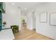 Hallway view through to dining area with view of backyard at 2200 N Glenwood Dr, Tampa, FL 33602