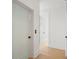 Hallway showing wood floors, white trim, and multiple doors at 2200 N Glenwood Dr, Tampa, FL 33602