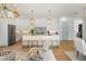 Bright open-concept kitchen featuring a kitchen island with seating, stainless steel appliances, and pendant lighting at 2200 N Glenwood Dr, Tampa, FL 33602