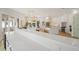 Open-concept living space featuring a quartz countertop, island kitchen, and stainless steel appliances at 2200 N Glenwood Dr, Tampa, FL 33602
