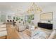 Bright living room featuring a dining table, wet bar, and sliding doors to a patio at 2200 N Glenwood Dr, Tampa, FL 33602