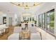 Bright living room featuring a dining table, bar with seating, and an open floor plan at 2200 N Glenwood Dr, Tampa, FL 33602