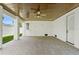 Spacious covered patio features stone floors, two doors, and a ceiling fan at 2200 N Glenwood Dr, Tampa, FL 33602