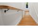Classic stairway with wooden steps and a traditional railing, offering a warm and inviting transition between floors at 2200 N Glenwood Dr, Tampa, FL 33602