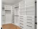 Large walk-in closet featuring custom shelving and drawers at 2200 N Glenwood Dr, Tampa, FL 33602