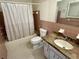 Bathroom with vanity, toilet, mirror, and shower/tub at 2263 Americus E Blvd # 25, Clearwater, FL 33763
