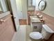 Bathroom features tiled walls, tiled floors, white toilet, and granite vanity at 2263 Americus E Blvd # 25, Clearwater, FL 33763