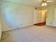 Carpeted bedroom featuring sliding closets and overhead lighting at 2263 Americus E Blvd # 25, Clearwater, FL 33763