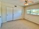 Bedroom with closet, large window allowing natural light to illuminate the room at 2263 Americus E Blvd # 25, Clearwater, FL 33763