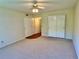 Bedroom with sliding closets, carpeted floor and overhead fan at 2263 Americus E Blvd # 25, Clearwater, FL 33763