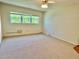 Bright bedroom features a ceiling fan and a window letting in lots of natural light at 2263 Americus E Blvd # 25, Clearwater, FL 33763
