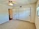 Bedroom with closet, large window allowing natural light to illuminate the room at 2263 Americus E Blvd # 25, Clearwater, FL 33763