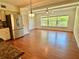 Open kitchen with light fixtures, window view, and modern stainless steel refrigerator at 2263 Americus E Blvd # 25, Clearwater, FL 33763