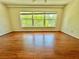 Bright living room with wood floors and large window views at 2263 Americus E Blvd # 25, Clearwater, FL 33763