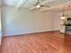 Spacious living room with wood floors, beamed ceilings, and natural light at 2263 Americus E Blvd # 25, Clearwater, FL 33763