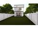Newly built modern home with a spacious backyard, white fence, and lush green grass at 2301 N Ridgewood Ave, Tampa, FL 33602