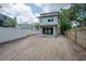 New construction home featuring large backyard with unfinished landscaping and modern siding at 2301 N Ridgewood Ave, Tampa, FL 33602