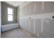 Under-construction bathroom featuring a Durarock tiled shower and tub area plus natural light from window at 2301 N Ridgewood Ave, Tampa, FL 33602