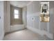 Bathroom featuring unfinished drywall, a bathtub, and a rendering showcasing bathroom design at 2301 N Ridgewood Ave, Tampa, FL 33602