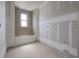 Bathroom with rough plumbing, drywall and a window for natural light at 2301 N Ridgewood Ave, Tampa, FL 33602