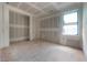 Bright room featuring drywall and a large window, awaiting personalization at 2301 N Ridgewood Ave, Tampa, FL 33602