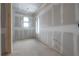 Bedroom under construction with two windows and ready for finishing touches at 2301 N Ridgewood Ave, Tampa, FL 33602