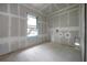 Bright bedroom under construction featuring a large window and ready for finishing at 2301 N Ridgewood Ave, Tampa, FL 33602