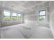 A spacious bedroom being remodeled that features bright natural light at 2301 N Ridgewood Ave, Tampa, FL 33602