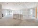 Spacious living room area featuring sliding glass doors and bright natural light at 2301 N Ridgewood Ave, Tampa, FL 33602