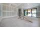 Large living room with walls ready for finishing, and access to covered patio at 2301 N Ridgewood Ave, Tampa, FL 33602