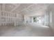 Unfinished living room with drywall, a sliding glass door, and a large, open floor plan at 2301 N Ridgewood Ave, Tampa, FL 33602