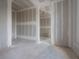 Spacious living room featuring a drywall finishing, providing a blank canvas for personalization at 2301 N Ridgewood Ave, Tampa, FL 33602