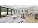 Bright living room with a light color scheme featuring sliding glass doors, hardwood floors, and modern furniture at 2301 N Ridgewood Ave, Tampa, FL 33602