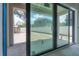 Large sliding glass doors lead to a covered patio and backyard at 2301 N Ridgewood Ave, Tampa, FL 33602