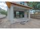 Modern patio under construction with unfinished siding and large glass sliding doors at 2301 N Ridgewood Ave, Tampa, FL 33602