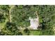 Aerial view of the property showing the home, surrounding trees, and yard at 2305 N 48Th St, Tampa, FL 33605