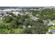 Aerial view of the property, showing it surrounded by trees in a neighborhood at 2305 N 48Th St, Tampa, FL 33605