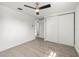 Bright bedroom with modern ceiling fan and closet with white sliding doors at 2305 N 48Th St, Tampa, FL 33605