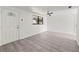 Bright living room features neutral walls, tile flooring, decorative front door and a ceiling fan at 2305 N 48Th St, Tampa, FL 33605